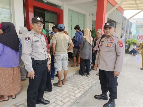 Polsek Bukit Batu Amankan Pembagian Kartu Huma Betang Sejahtera di Tangkiling