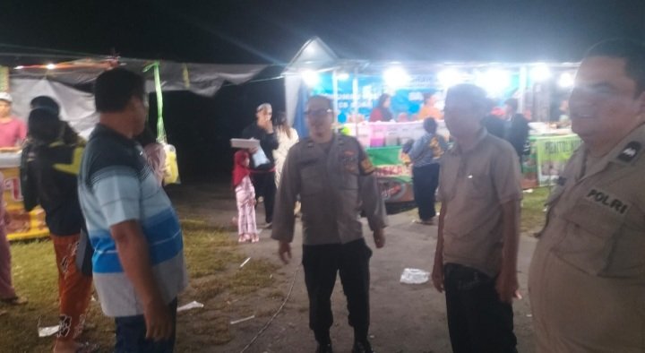 Polsek Bukit Batu Ciptakan Suasana Aman di Pasar Malam Banturung